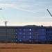 Construction on new barracks continues at sunrise at Fort McCoy