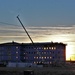 Sun sets next to new barracks at Fort McCoy