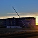 Sun sets next to new barracks at Fort McCoy