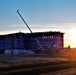 Sun sets next to new barracks at Fort McCoy