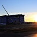 Sun sets next to new barracks at Fort McCoy