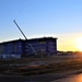 Sun sets next to new barracks at Fort McCoy