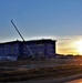 Sun sets next to new barracks at Fort McCoy