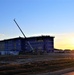 Sun sets next to new barracks at Fort McCoy