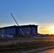Sun sets next to new barracks at Fort McCoy