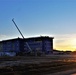 Sun sets next to new barracks at Fort McCoy