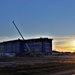 Sun sets next to new barracks at Fort McCoy