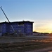 Sun sets next to new barracks at Fort McCoy