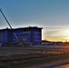 Sun sets next to new barracks at Fort McCoy