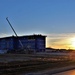 Sun sets next to new barracks at Fort McCoy