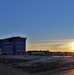 Sun sets next to new barracks at Fort McCoy