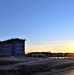 Sun sets next to new barracks at Fort McCoy