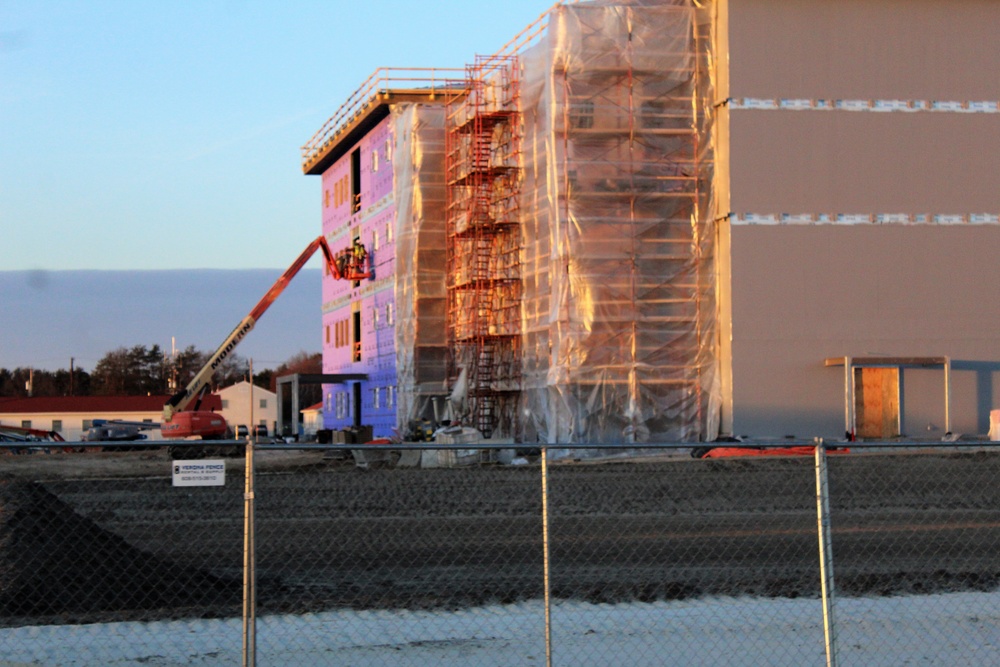 Sun sets next to new barracks at Fort McCoy