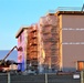 Sun sets next to new barracks at Fort McCoy