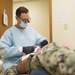 Navy Dental Officer Performs Examinations on Seabee Deployment