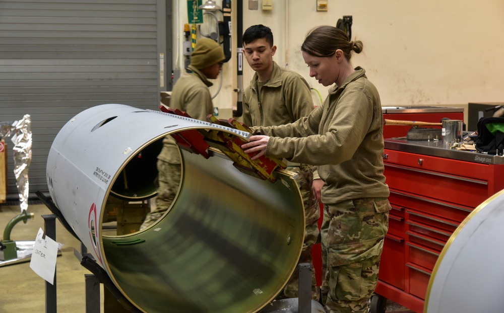 Maintainers construct external fuel tanks