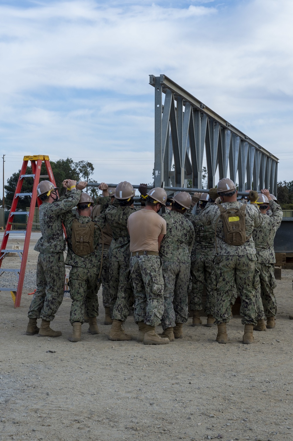 Seabees with NMCB-5 assemble a Mabey Johnson bridge