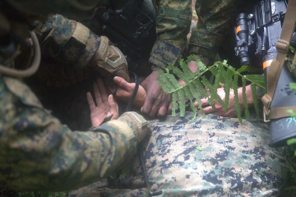 U.S. Marine Corps military police practice detainee handling drills