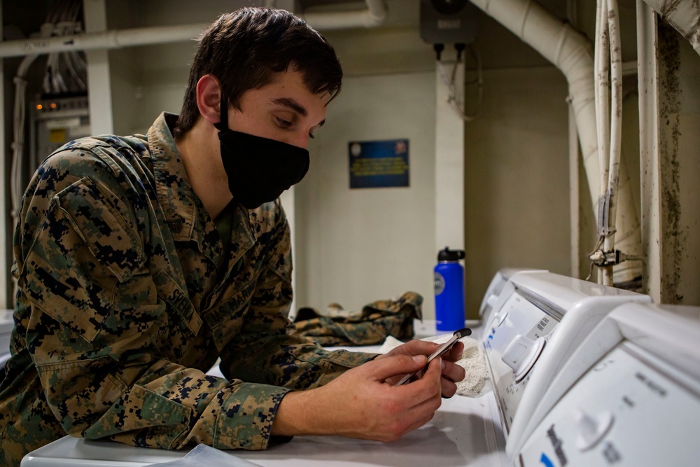 15th MEU Marines aboard USS Makin Island clean laundry