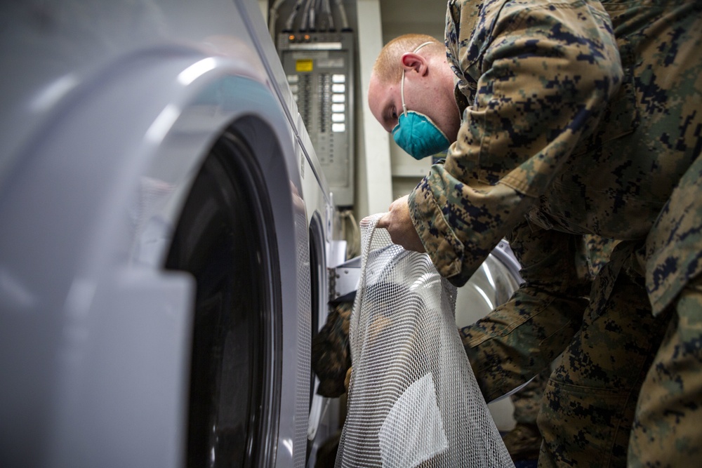 15th MEU Marines aboard USS Makin Island clean laundry