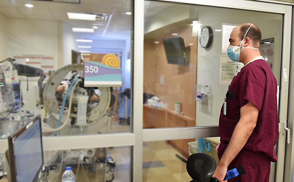 Doctors and nurses from 59th Medical Wing work at University Medical center of El Paso