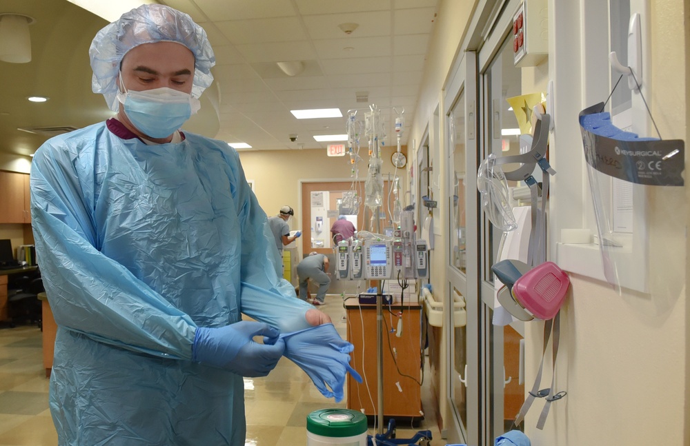 Doctors and nurses from 59th Medical Wing work at University Medical center of El Paso