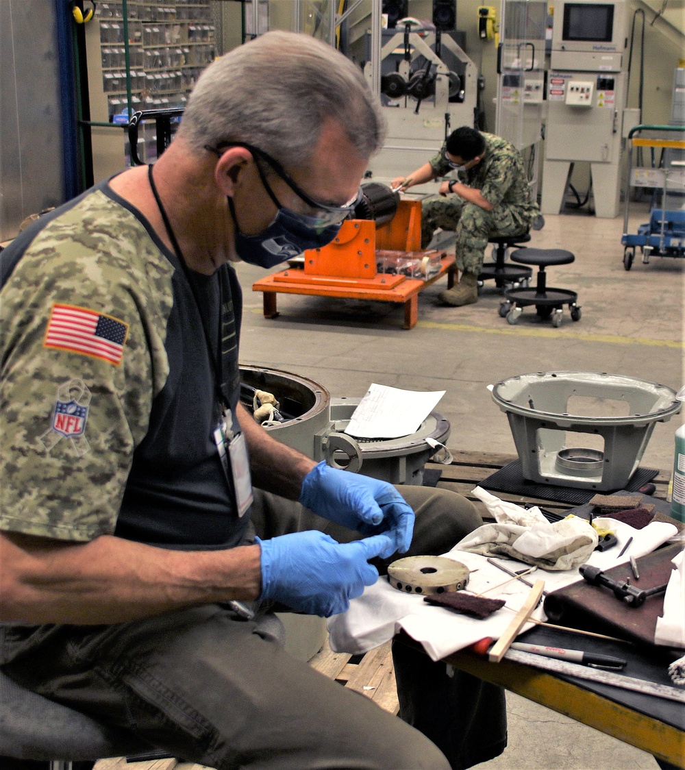 TRFB electrician works on motor