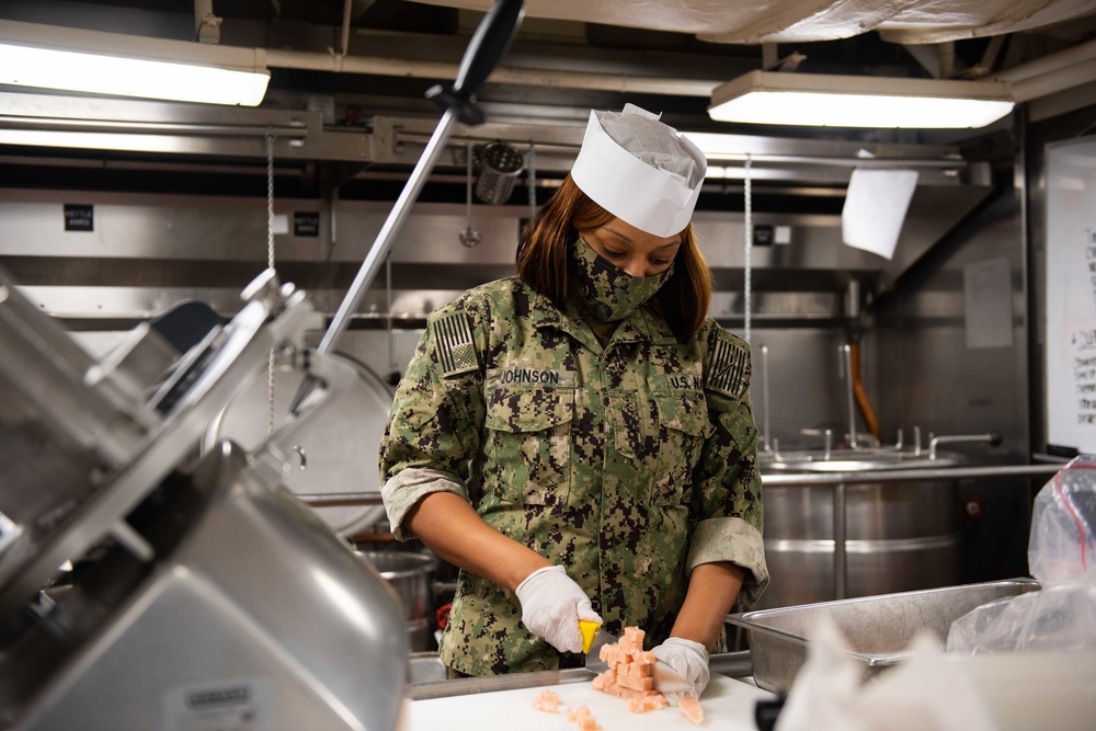 Sailor prepares food