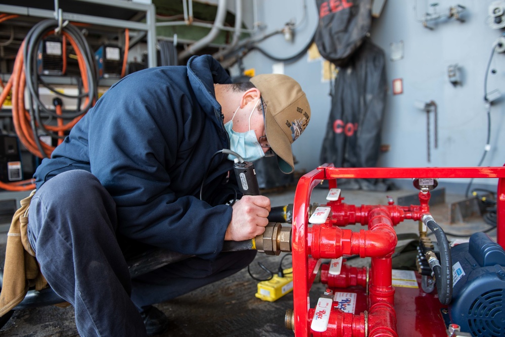 Sailor writes inspection date on AFFF hose