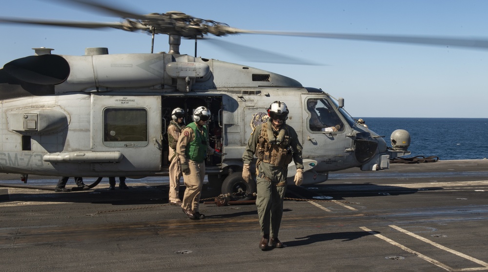 Rear Admiral Kirk Disembarks Helicopter