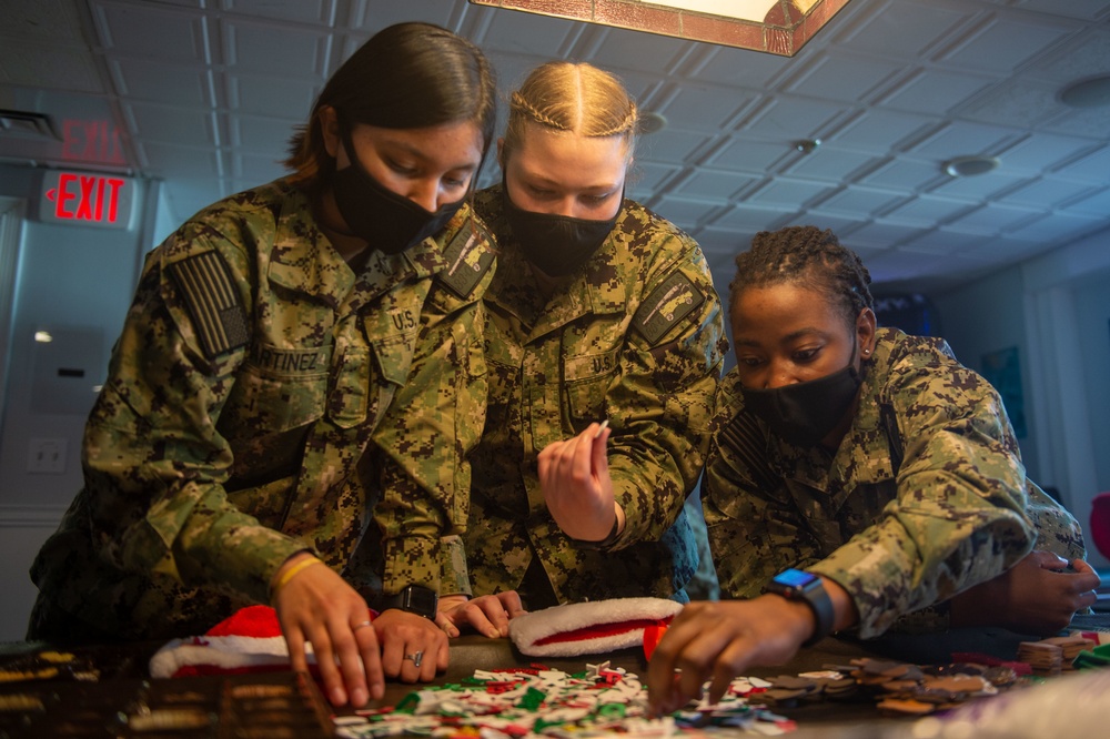 USS Constitution Sailors decorate stockings for the holidays