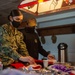 USS Constitution Sailors decorate stockings for the holidays