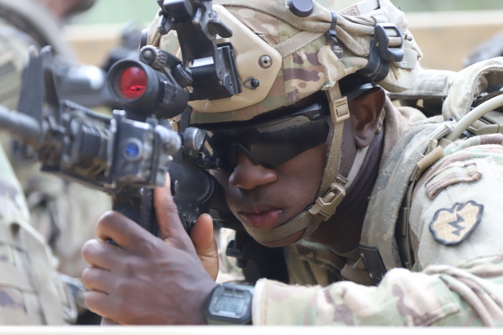 25ID Soldier looks through weapon sight in the prone position during a JRTC rotation