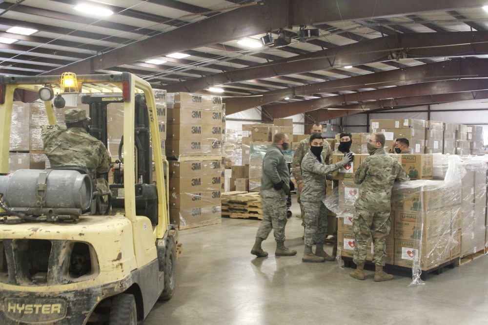 Arizona National Guard service members provide support at a Pima County PPE warehouse.