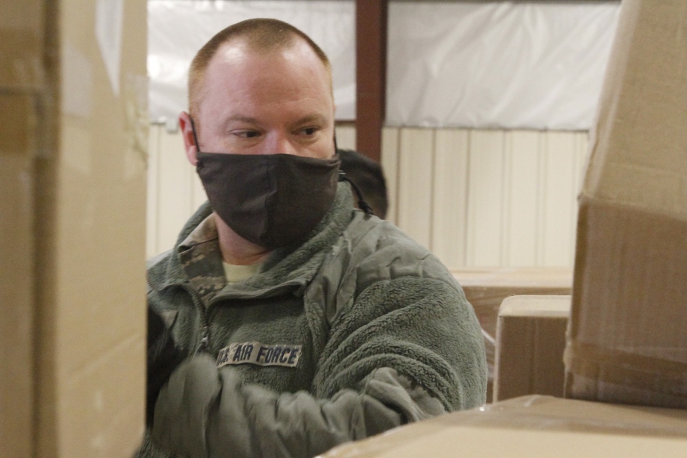 Arizona National Guard service members provide support at a Pima County PPE warehouse.