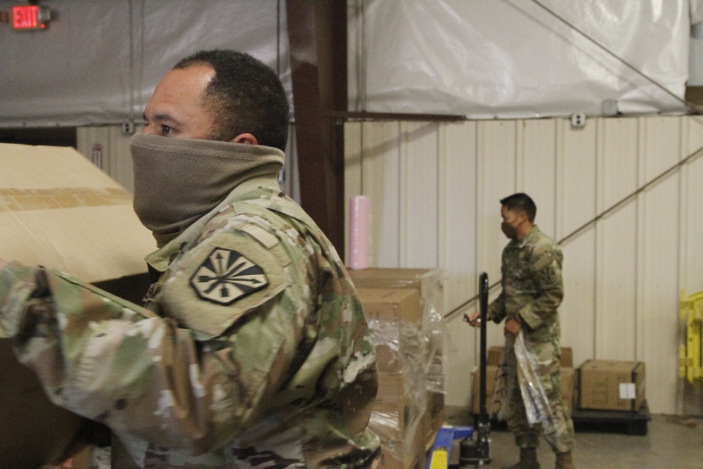 Arizona National Guard service members provide support at a Pima County PPE warehouse.