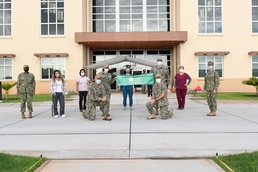 NMRTC-PH Nursing and Leadership Staff Proudly Hold the DAISY Award Banner