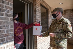 97 AMW Leaders deliver cookies to Airmen
