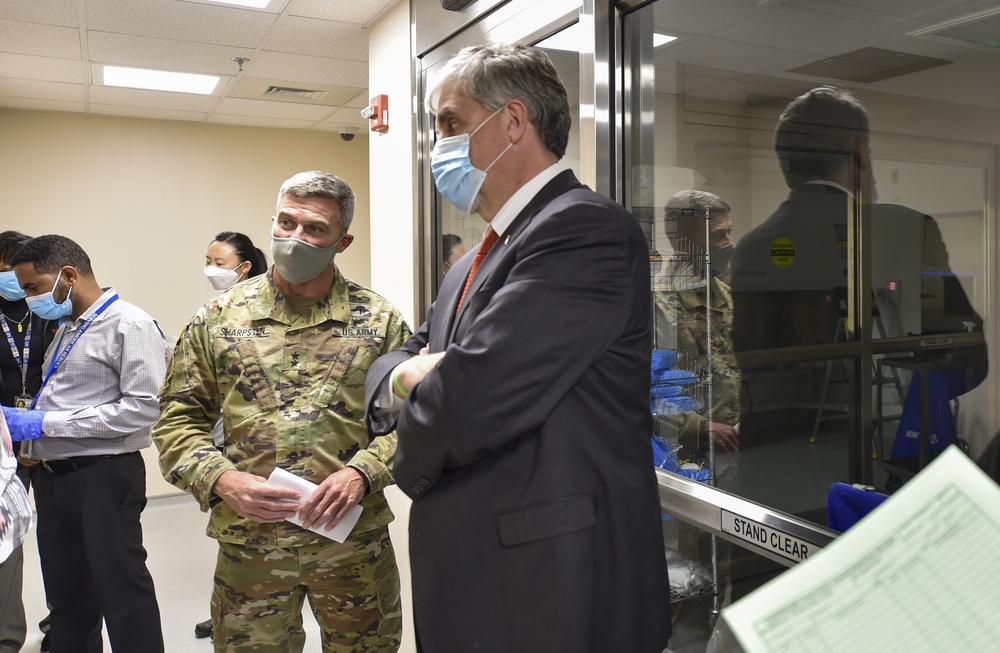 Maj. Gen. Christopher Sharpsten and Eric Hargan observe Pfizer's COVID-19 vaccine