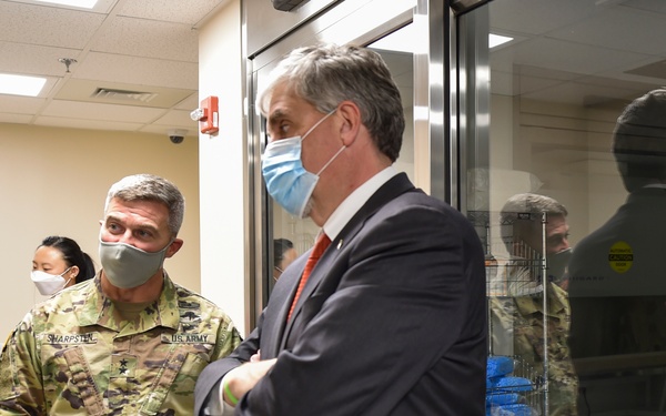 Maj. Gen. Christopher Sharpsten and Eric Hargan observe Pfizer's COVID-19 vaccine