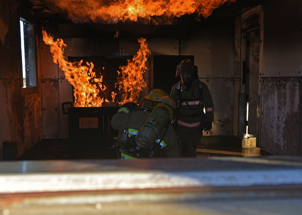 Firedogs douse burning interiors