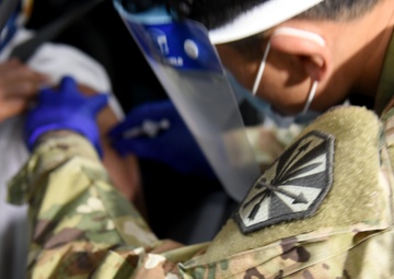 Arizona National Guard soldier administers COVID-19 vaccine