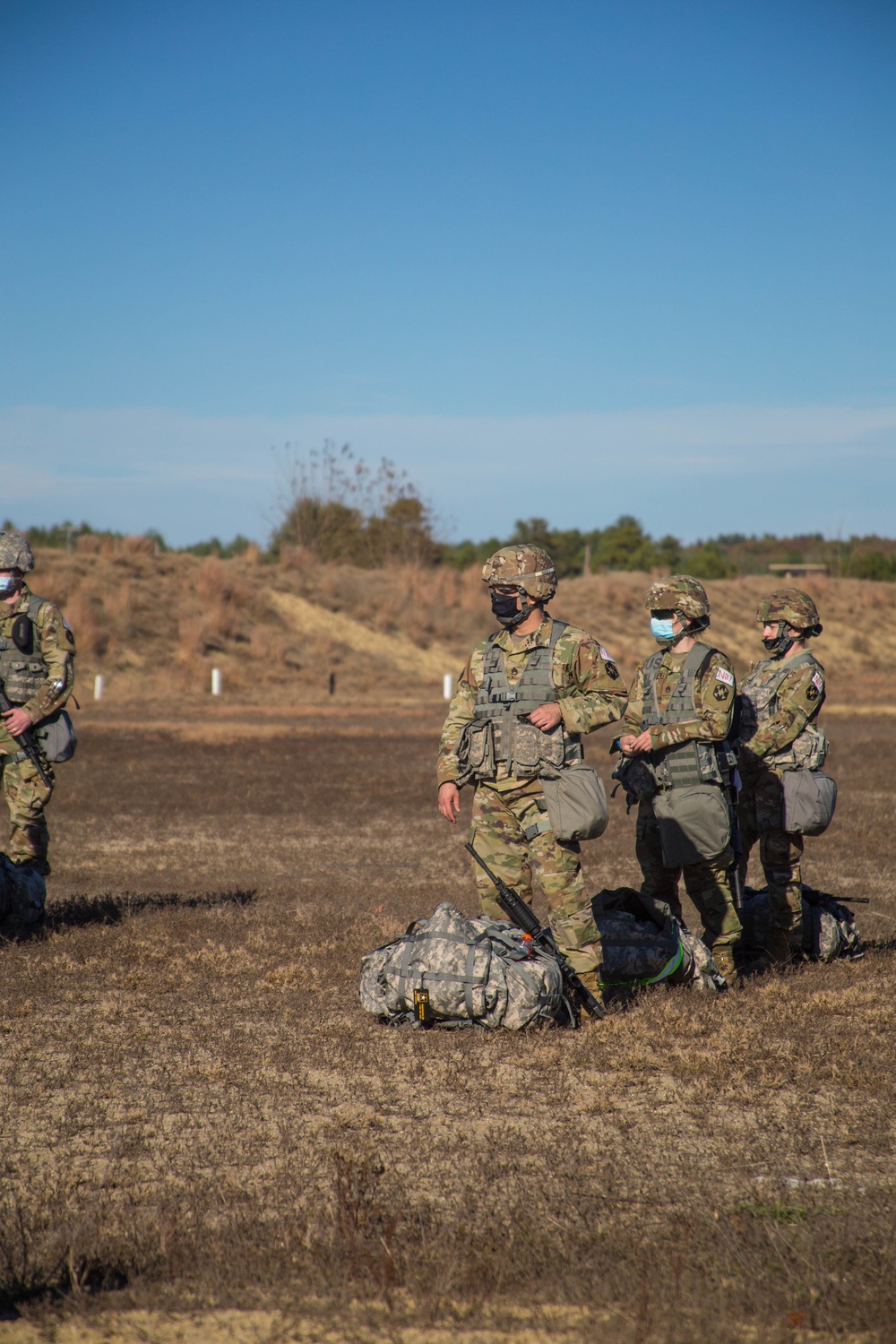 Members of the 804th waiting for their turn to compete in the stress shoot exercise.