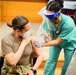 Army ICU nurse receives first COVID-19 vaccine at BAMC