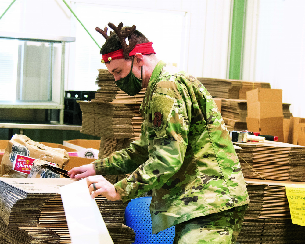 The Michigan National Guard at food banks and soup kitchens, gathering food for the community