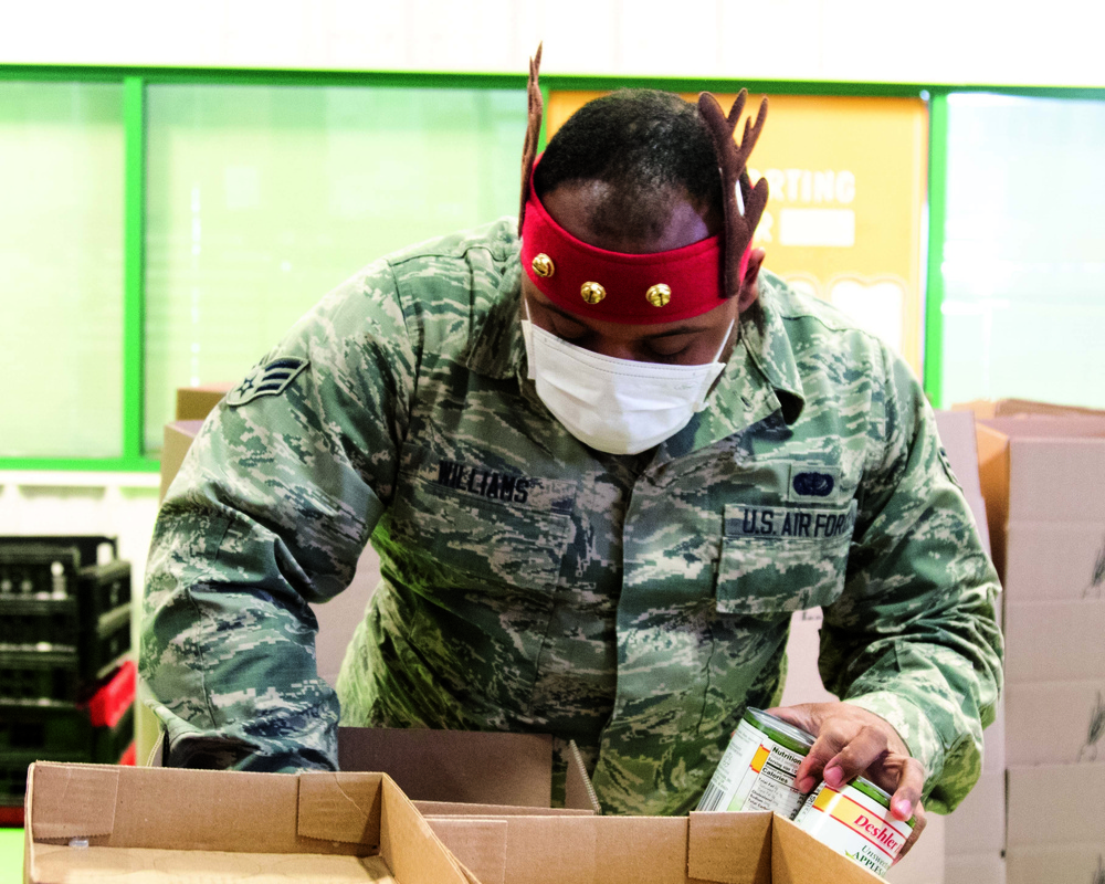 Michigan National Guard at food banks and soup kitchens, gathering food for the community