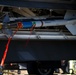 Team Tyndall Airmen load AIM-9 missiles on F-22s