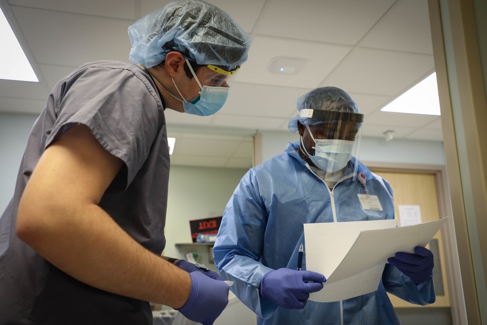 Nurses and techs from UAMTF- 531 help with patient care at Marshfield Medical Center in Eau Claire, Wisconsin