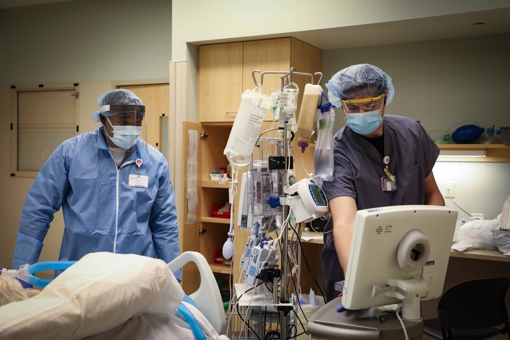 Nurses and techs from UAMTF-531 help with patient care at Marshfield Medical Center in Eau Claire, Wisconsin