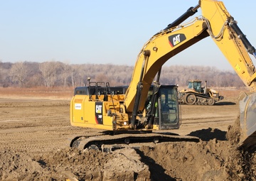 Hydraulic excavator on the L-594 levee